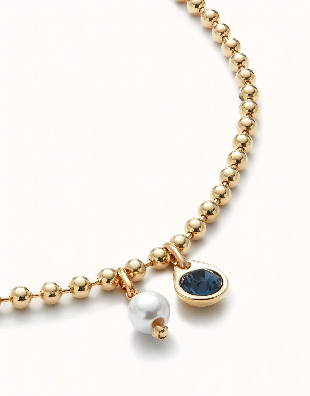 Ladies mixed stone necklaces-UNOde50 Gold Ball Necklace with Pearl & Blue Charm