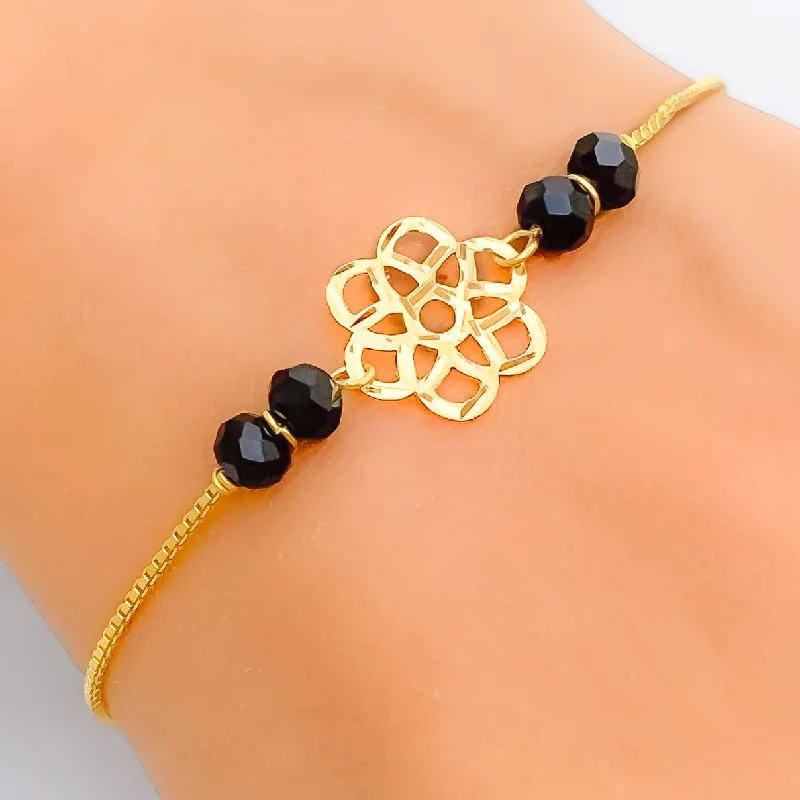 Ladies luxury bangles-Dazzling Flower 22k Gold Black Bead Bracelet