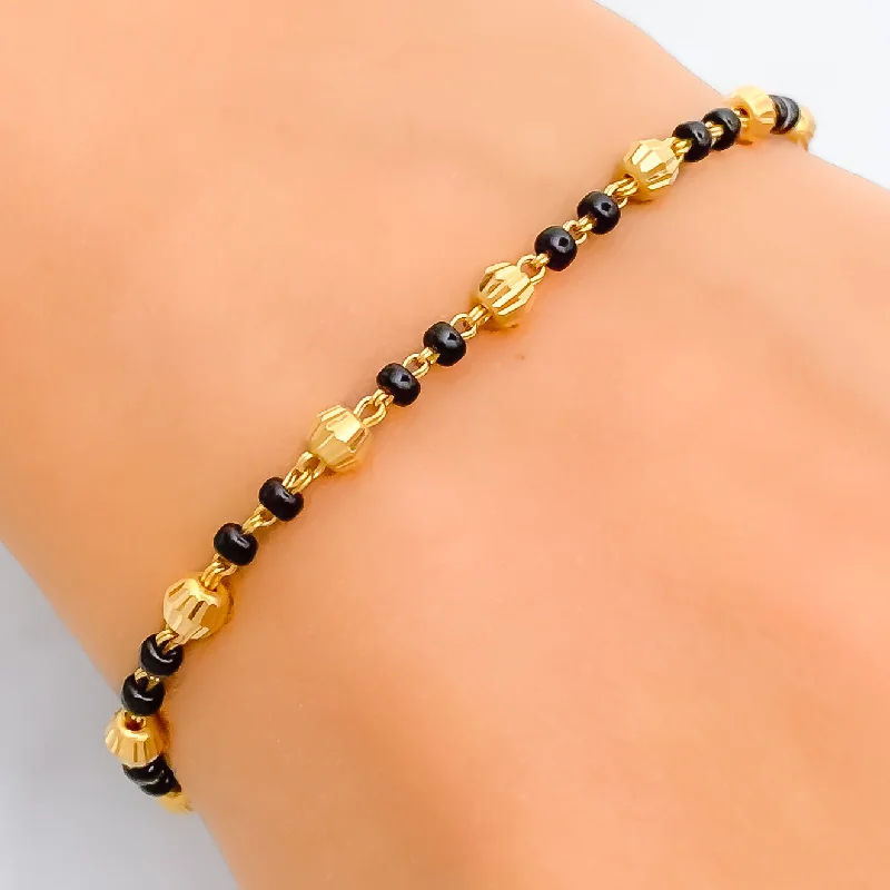 Ladies mixed-metal bracelets-Dainty Chic 22k Gold Black Bead Bracelet