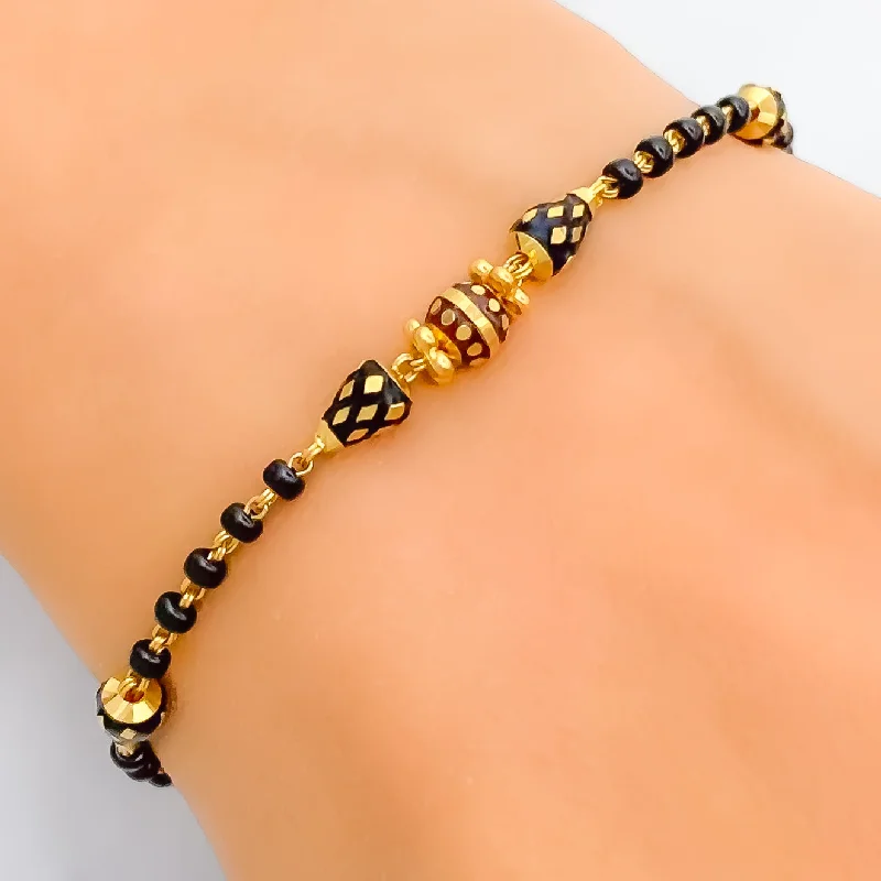 Ladies chic bracelets-Luminous Lightweight 22k Gold Black Bead Bracelet