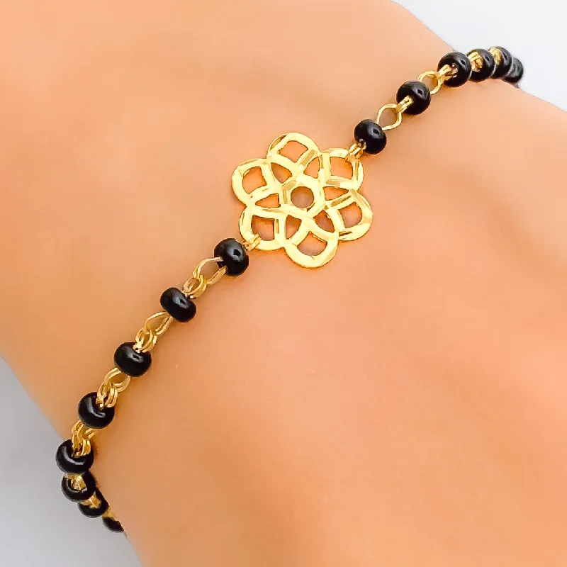 Ladies delicate bangles-Subtle Flower 22k Gold Black Bead Bracelet