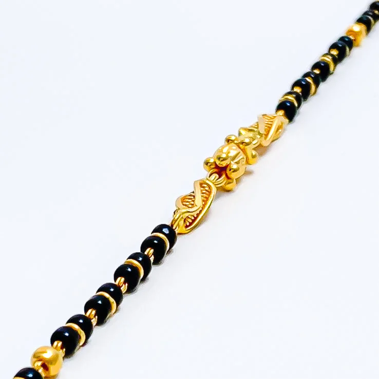 Ladies fancy bangles-Striking Petite 22k Gold Black Bead Baby Bracelet