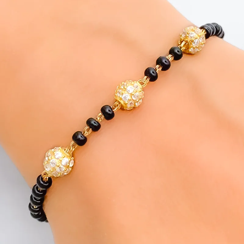 Ladies custom-made bracelets-Elegant Orb 22k Gold Black Bead Bracelet